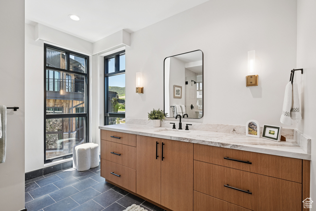 Bathroom with vanity and tile patterned flooring