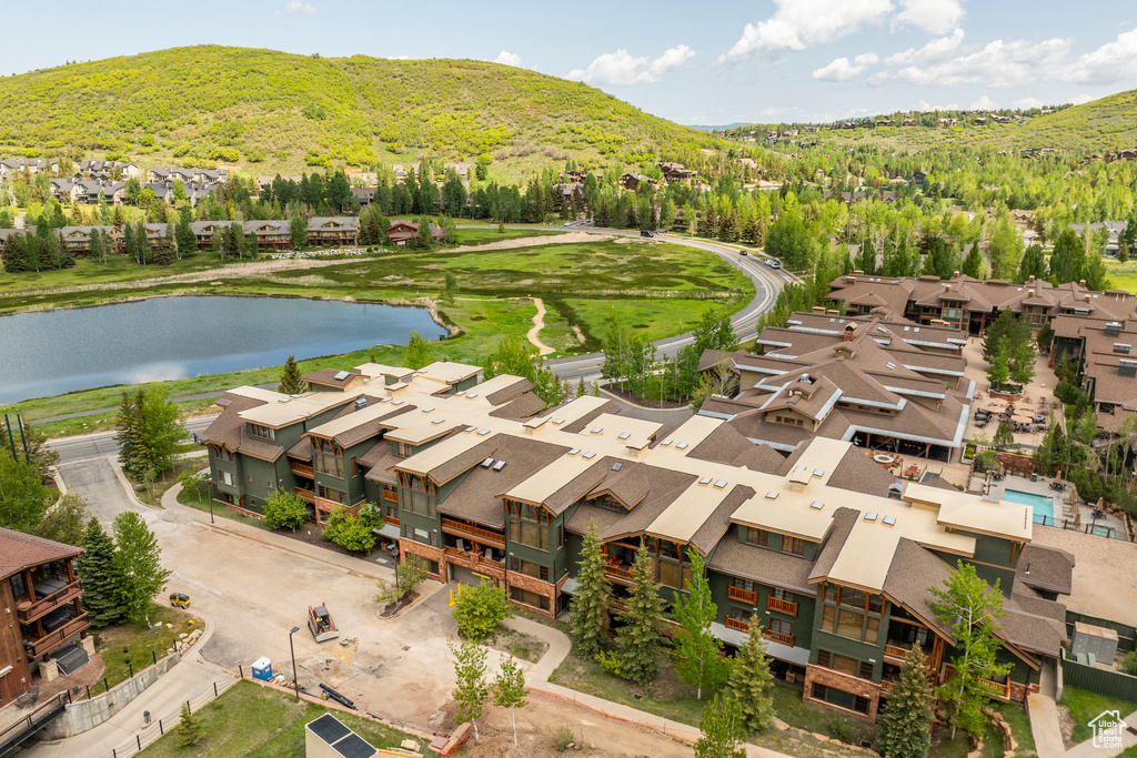 Aerial view of residential area featuring a water and mountain view