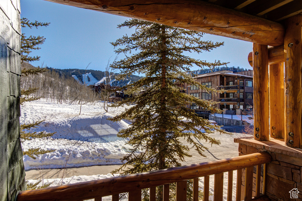 Snowy yard with a mountain view