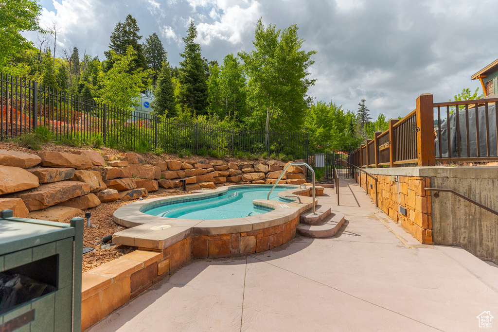 View of swimming pool with a patio