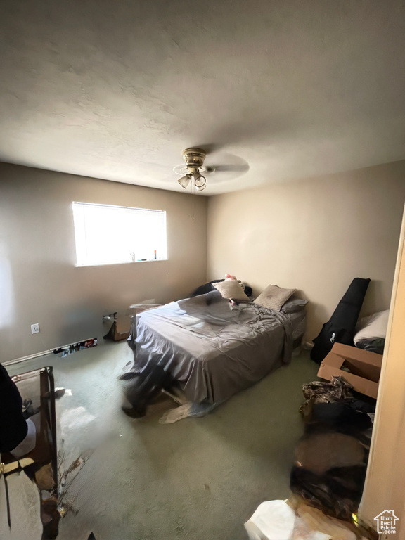 Bedroom with carpet and a ceiling fan