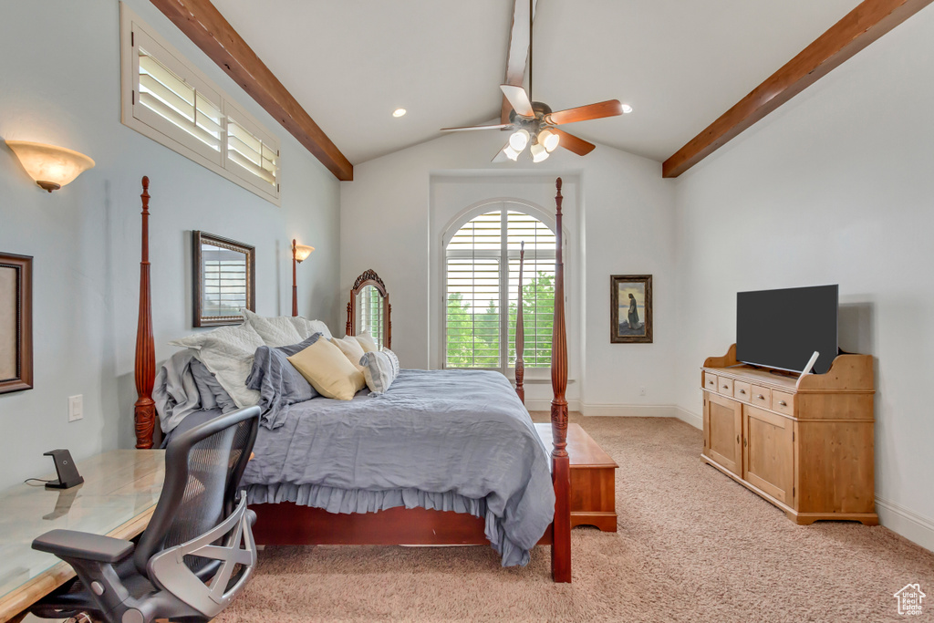 Bedroom featuring light colored carpet, ceiling fan, and baseboards