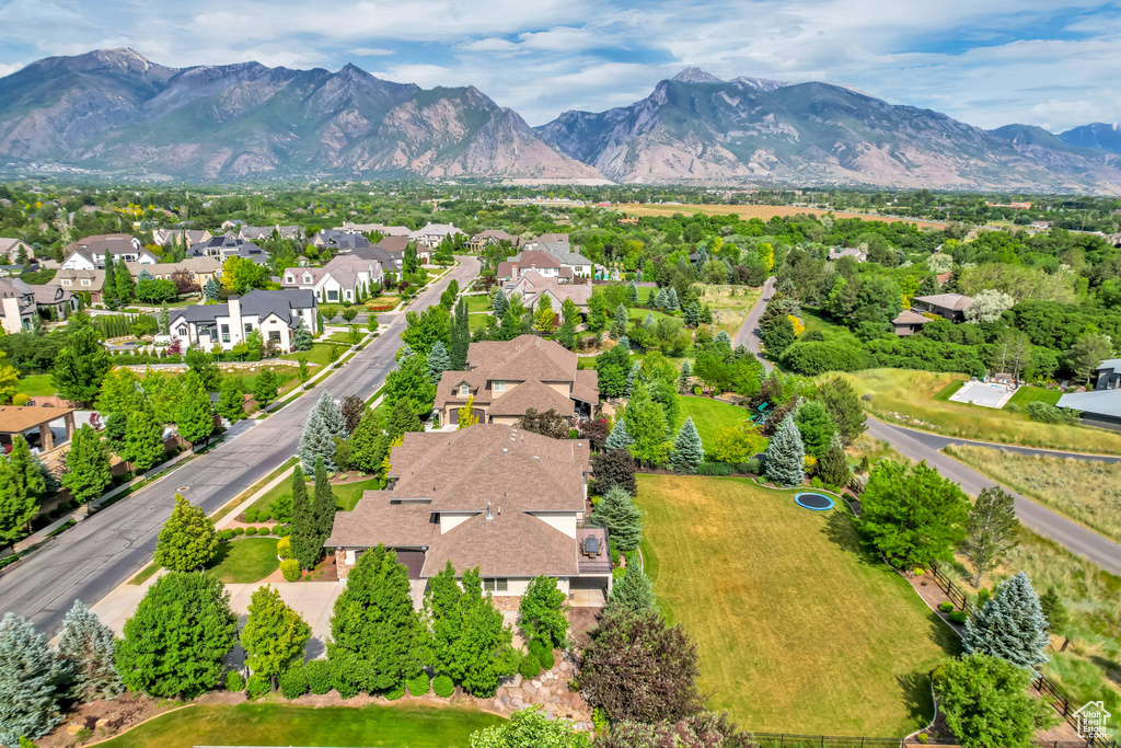 Aerial view of residential area featuring mountains