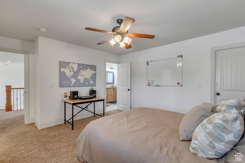 Bedroom featuring carpet floors, baseboards, and ceiling fan