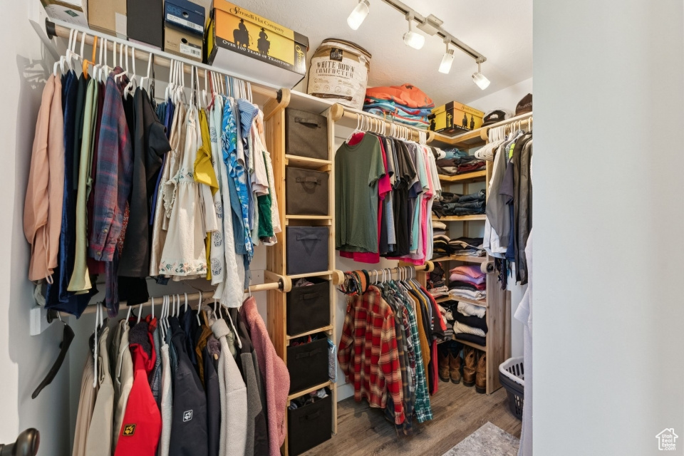 Spacious closet featuring wood finished floors