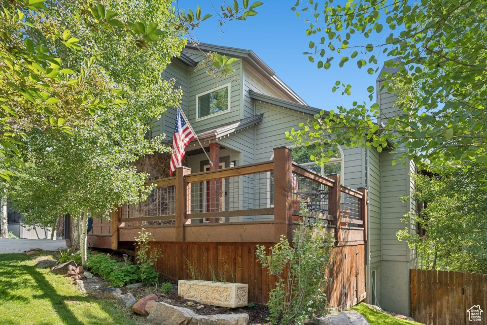 Rear view of house with a wooden deck
