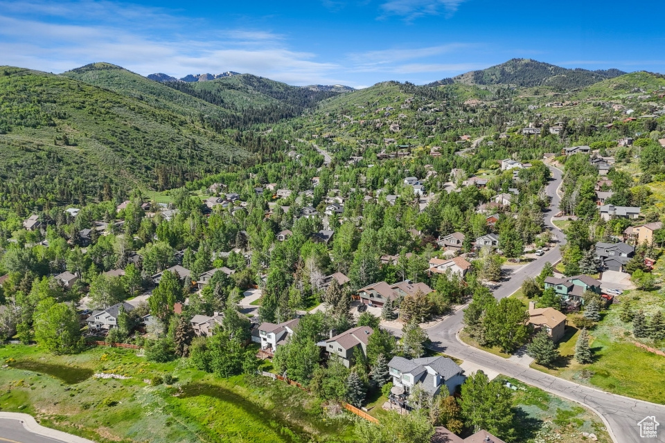 View of property location with a mountainous background and nearby suburban area