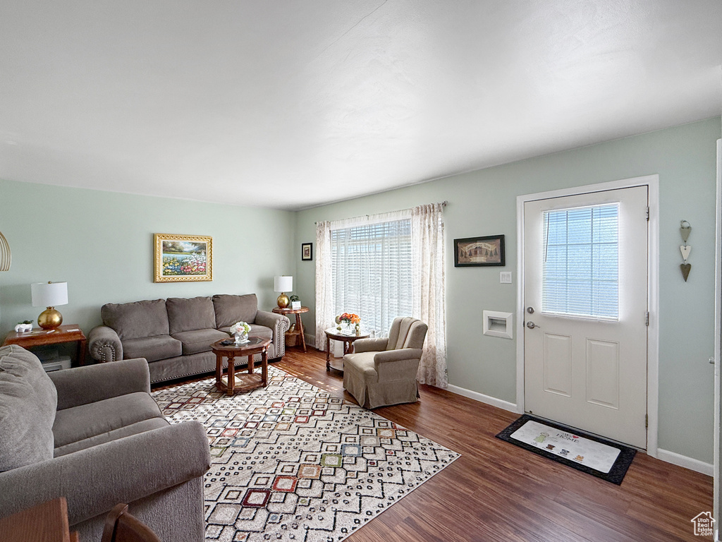 Living room with wood finished floors and baseboards
