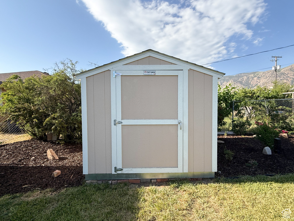 View of shed with a mountain view