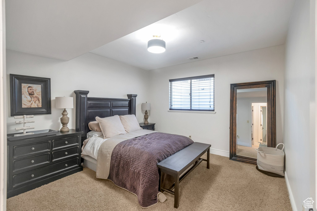 Bedroom with carpet floors and baseboards
