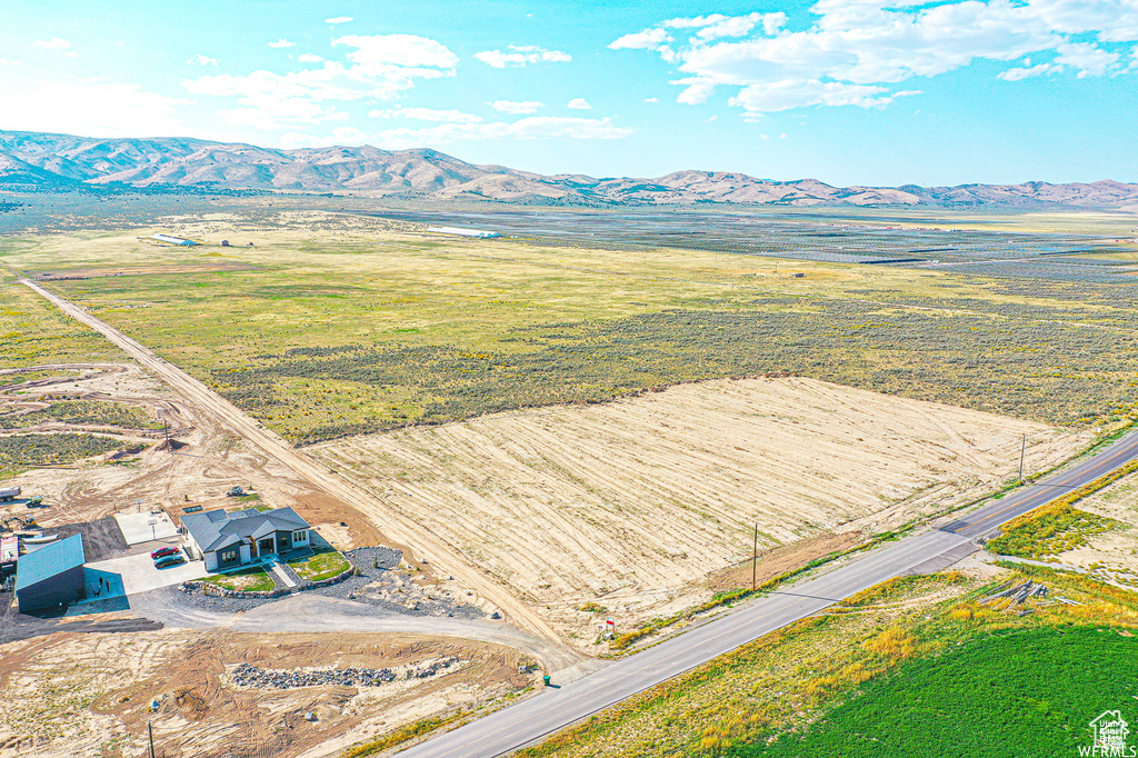 Aerial view of sparsely populated area featuring a mountain backdrop