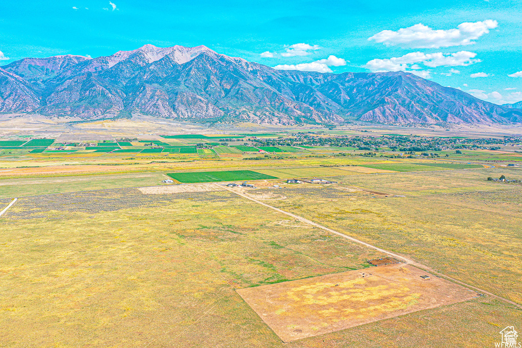 View of mountain backdrop with rural landscape