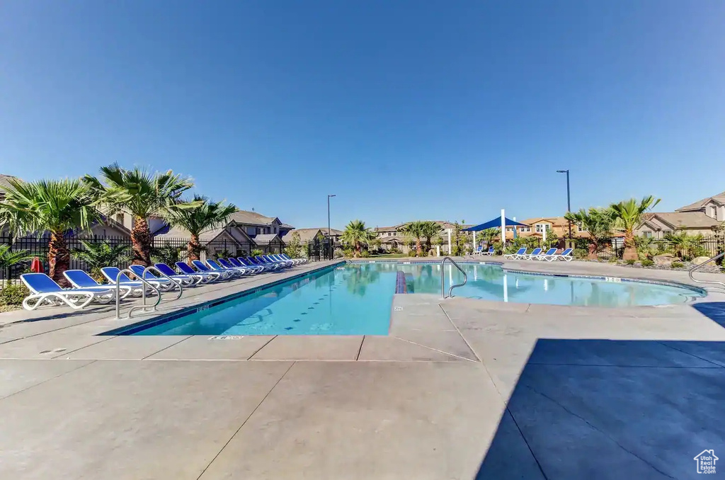 Community pool featuring a patio