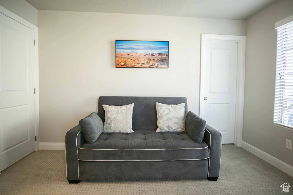 Living area with carpet flooring and baseboards