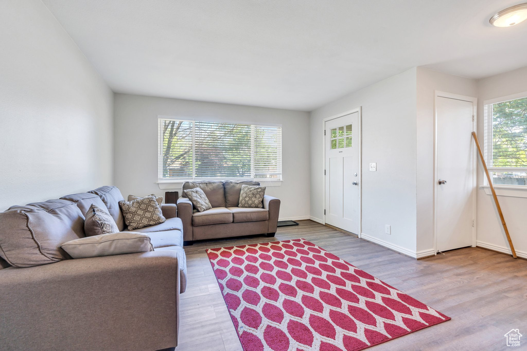 Living room featuring wood finished floors and baseboards