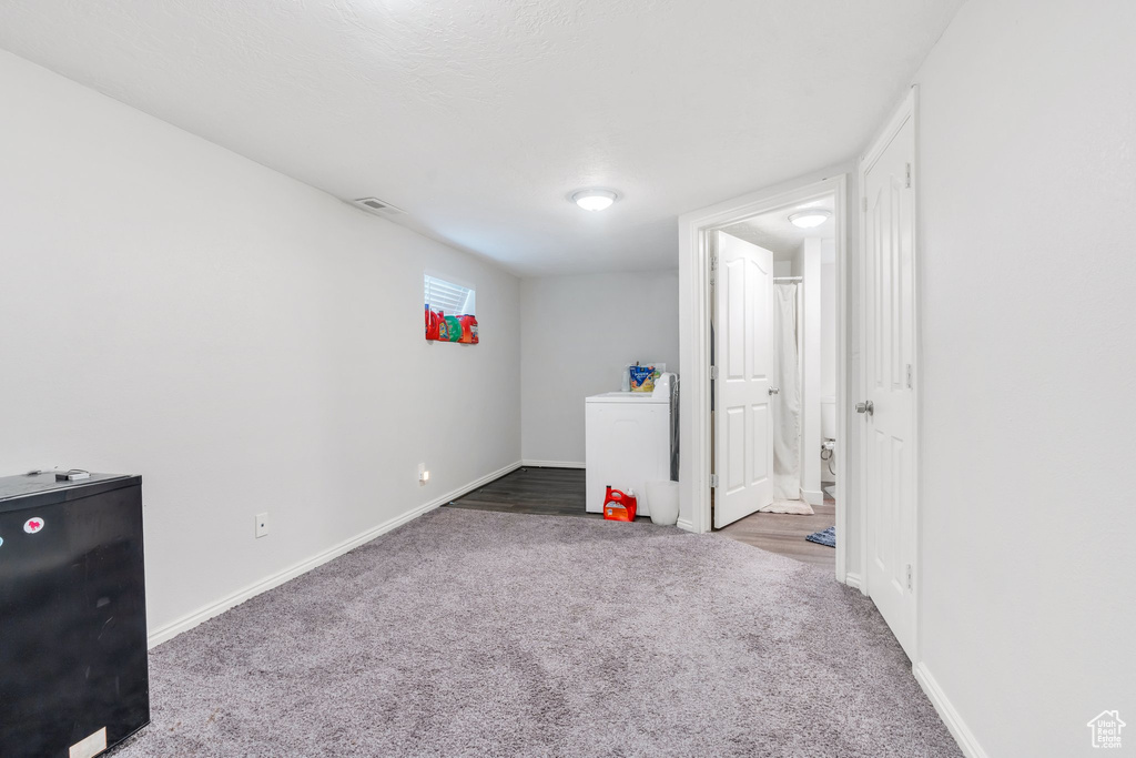 Unfurnished bedroom with carpet floors and baseboards