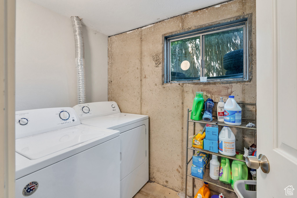 Washroom with washer and clothes dryer