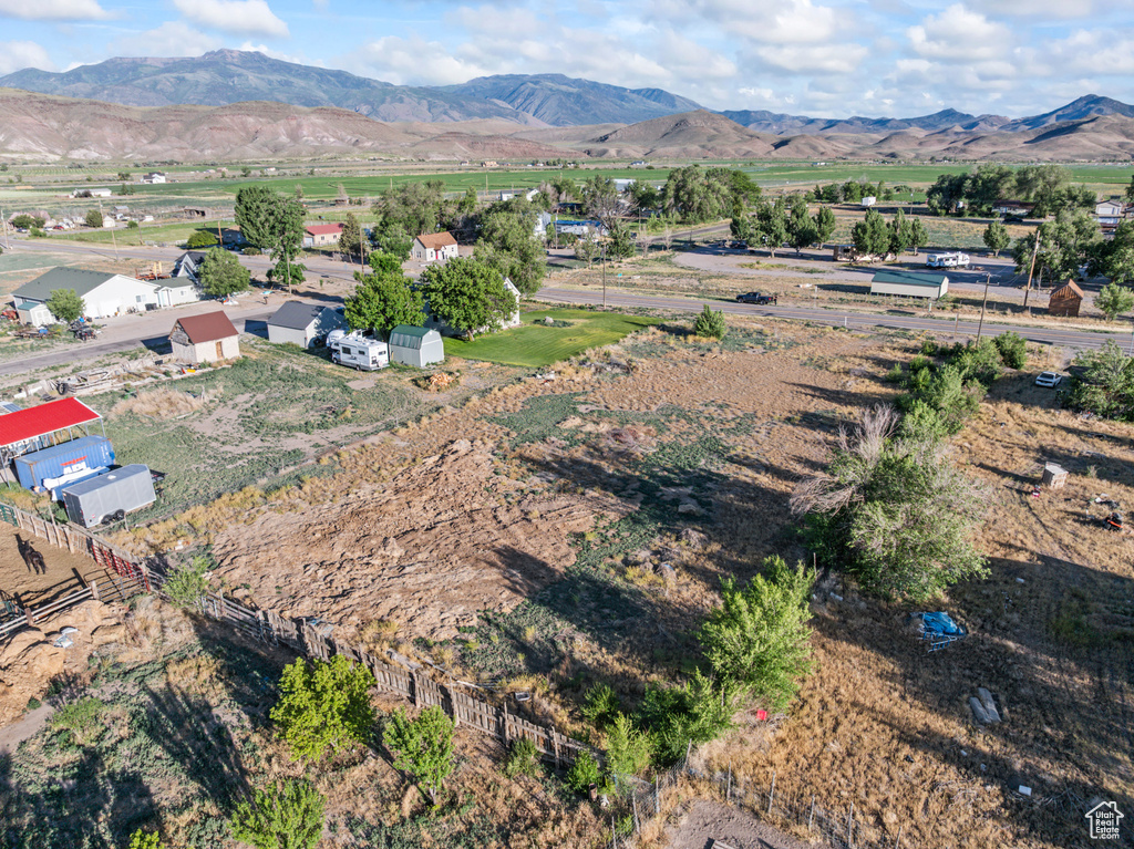 Aerial view of sparsely populated area featuring a mountainous background