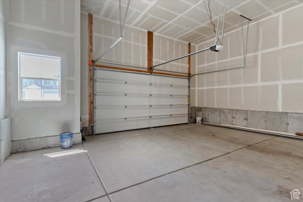 Garage featuring a garage door opener