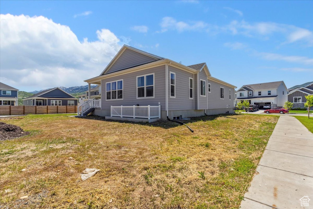 View of side of home with a residential view