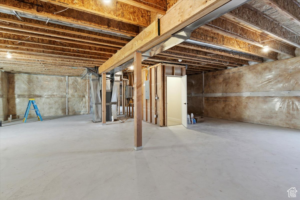 Unfinished below grade area with electric panel