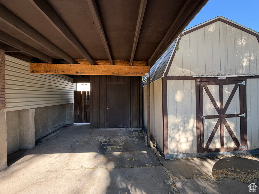 View of outbuilding featuring an attached carport
