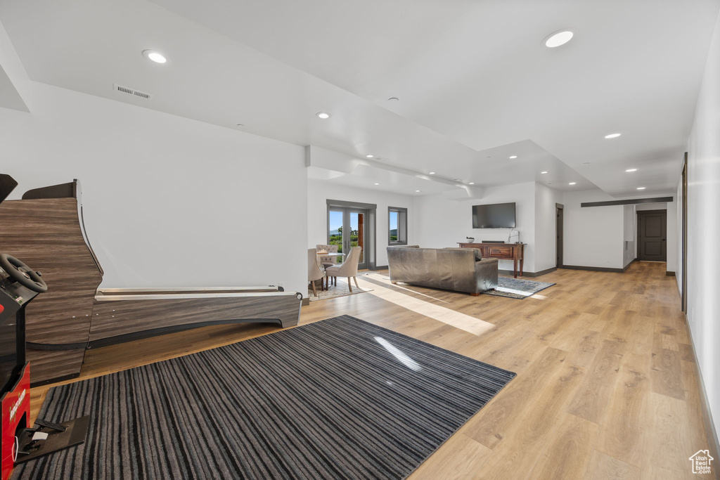 Living area featuring recessed lighting and light wood-style floors