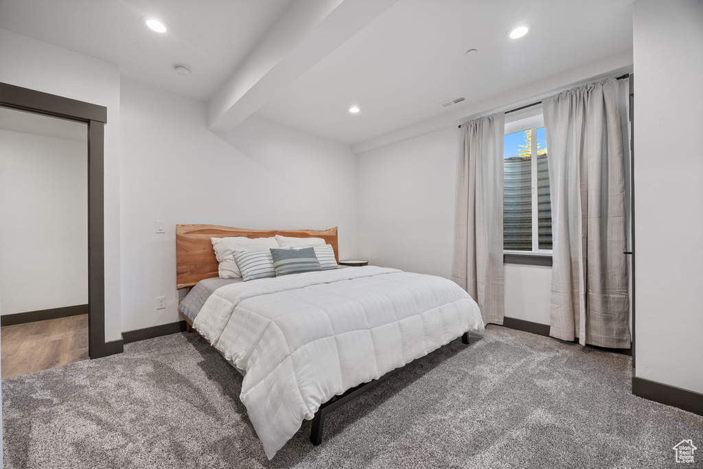 Bedroom with carpet flooring, baseboards, and recessed lighting