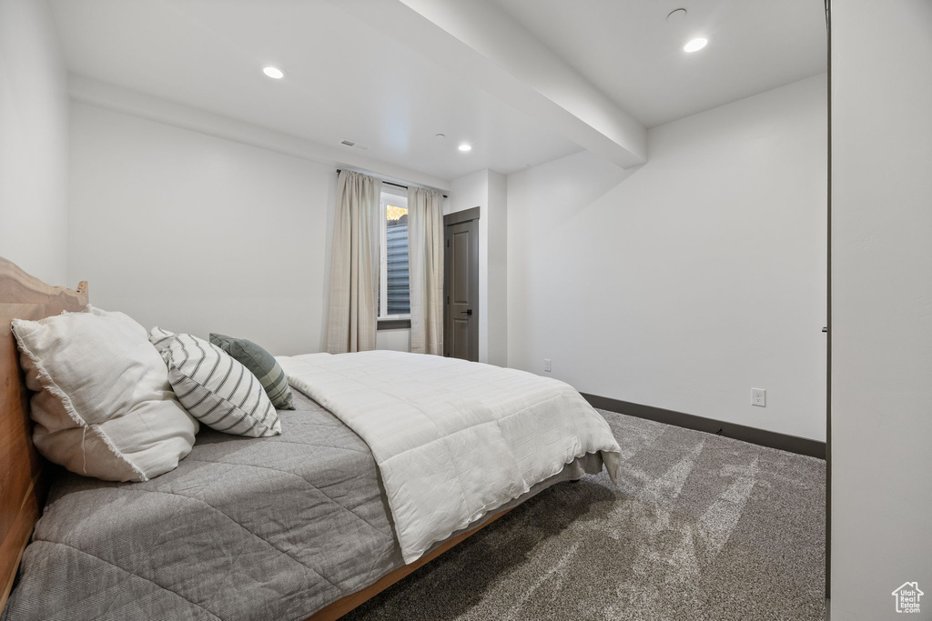 Carpeted bedroom with recessed lighting and baseboards