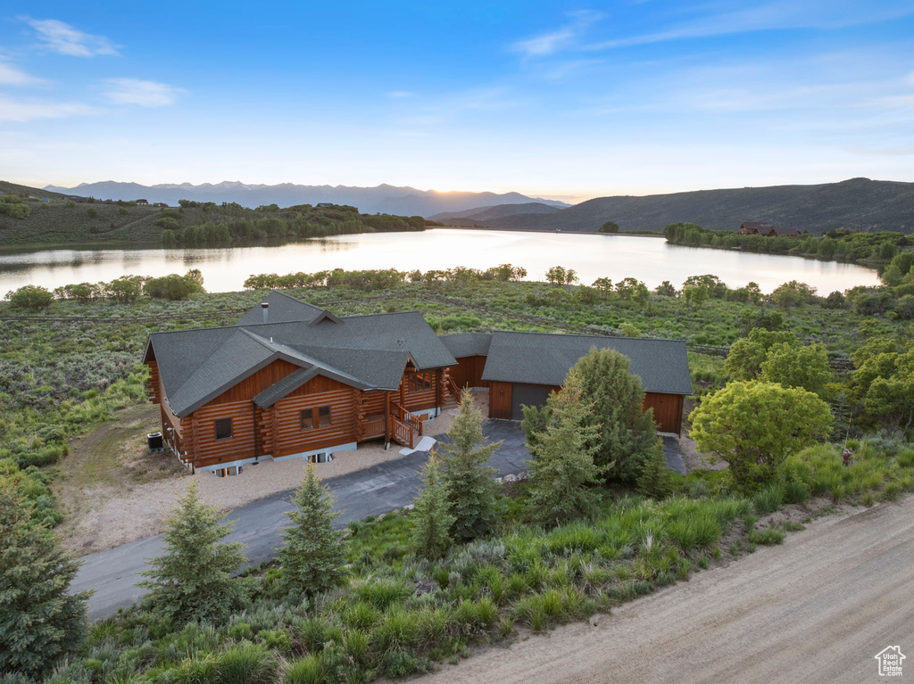 View from above of property featuring a water and mountain view