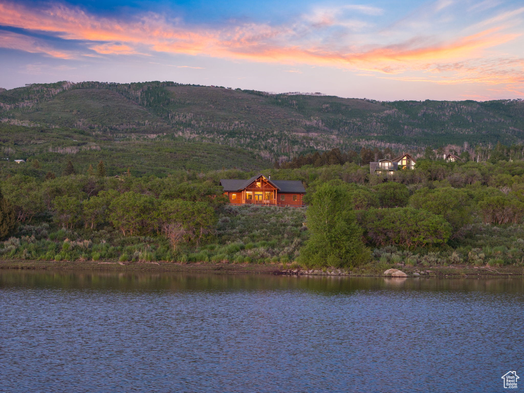 Aerial view at dusk of a water view and a forest view
