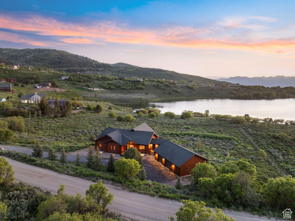 Aerial view at dusk of a water and mountain view