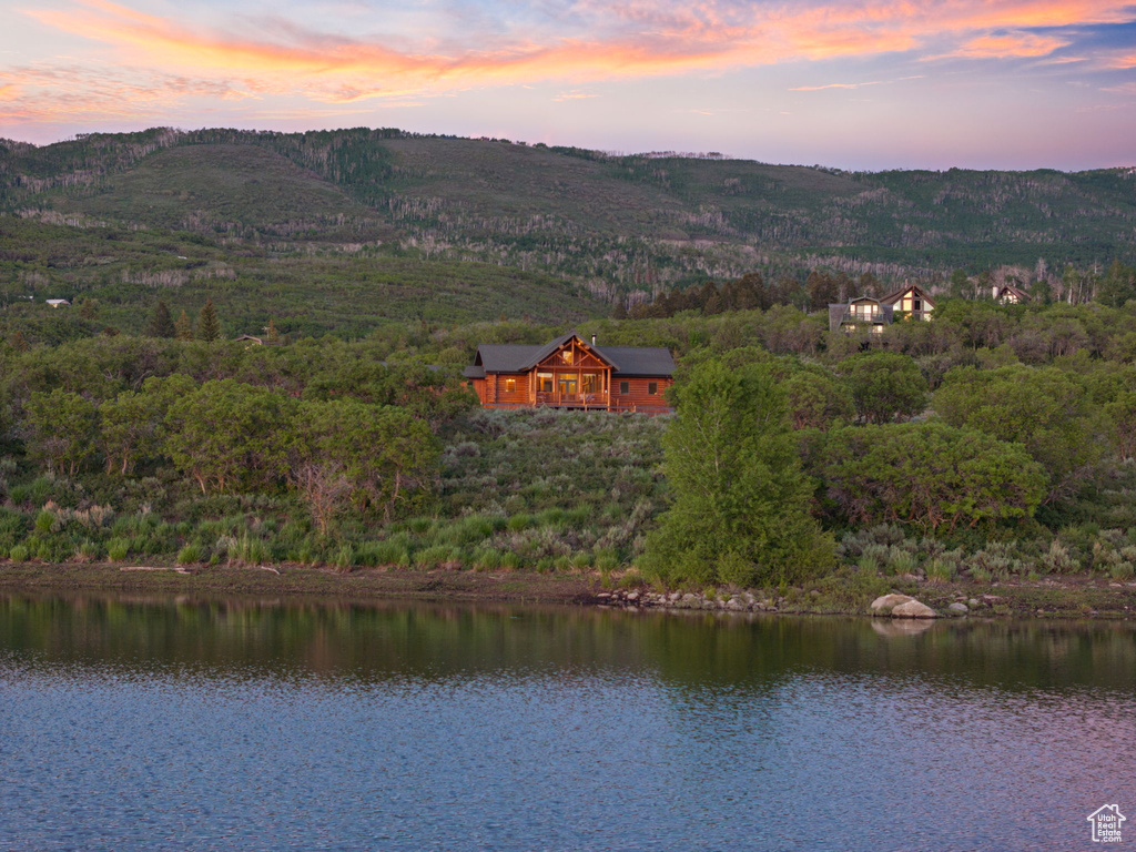 Aerial view at dusk of a water view and a forest view
