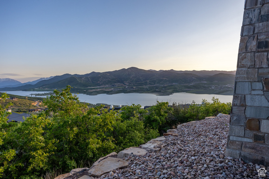 View of mountain backdrop featuring a large body of water