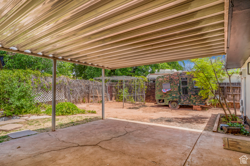 Fenced backyard with a patio area
