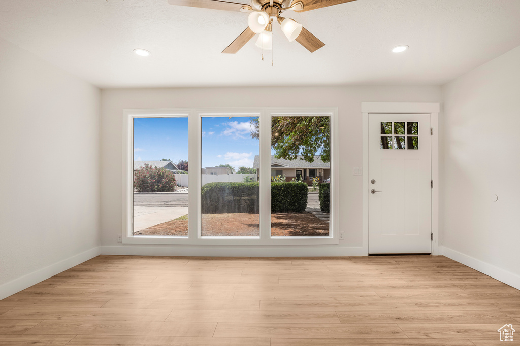 Foyer entrance featuring baseboards, recessed lighting, light wood finished floors, and a ceiling fan