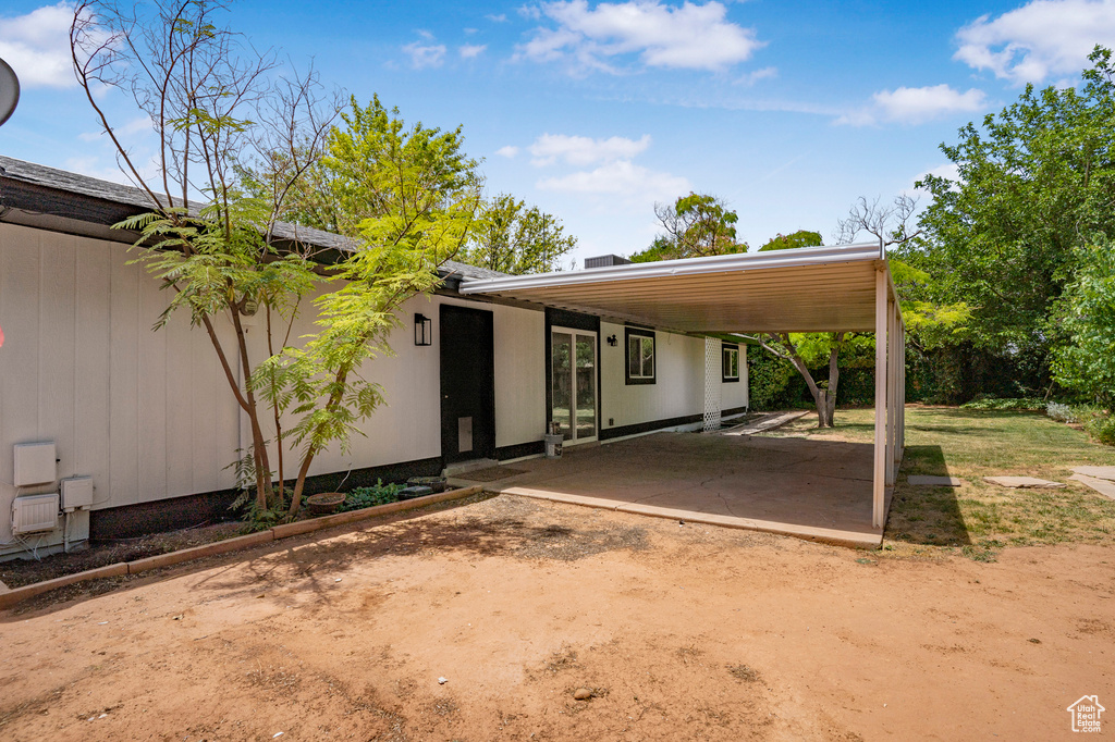 View of front of house featuring an attached carport