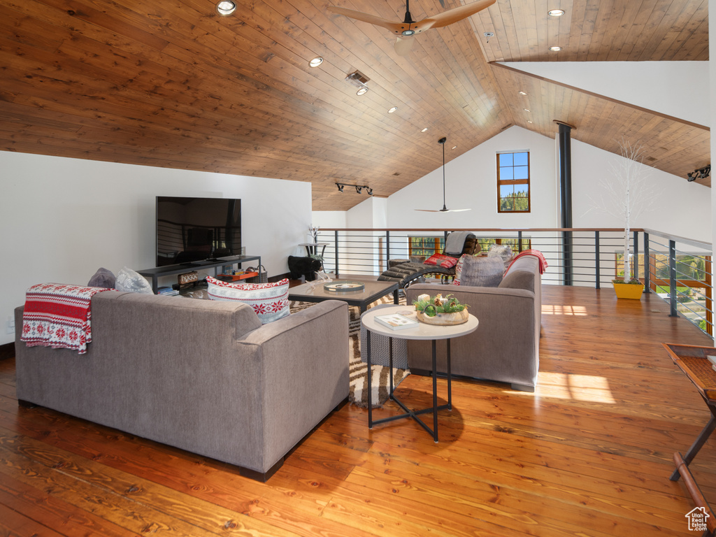Living room featuring ceiling fan, hardwood / wood-style floors, wooden ceiling, recessed lighting, and high vaulted ceiling