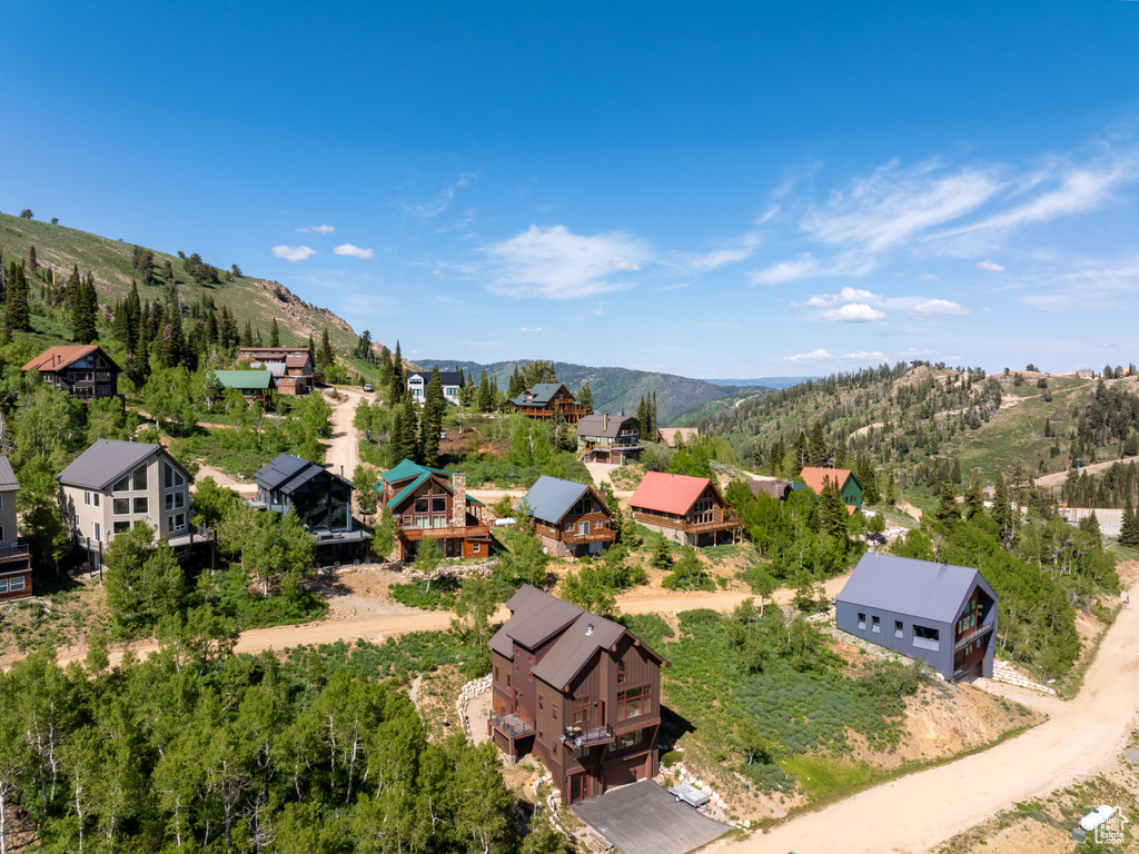 Aerial view of residential area featuring a mountainous background