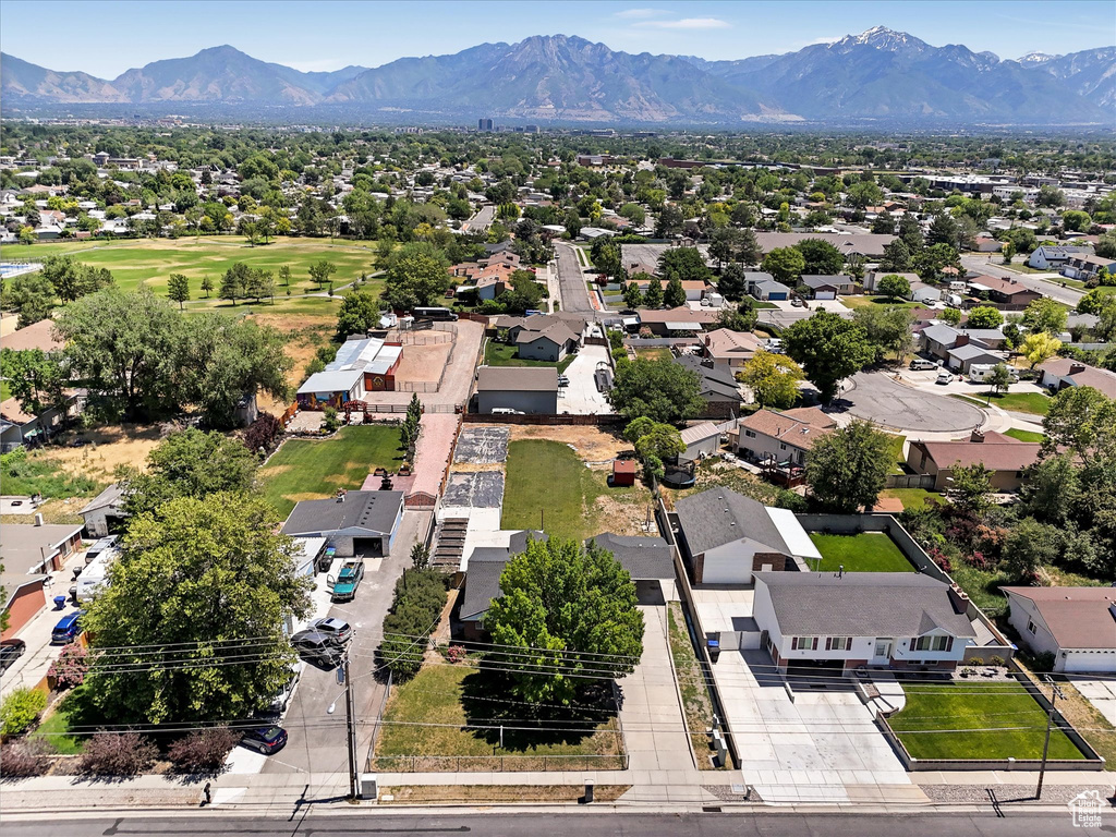 Aerial perspective of suburban area with a mountain backdrop