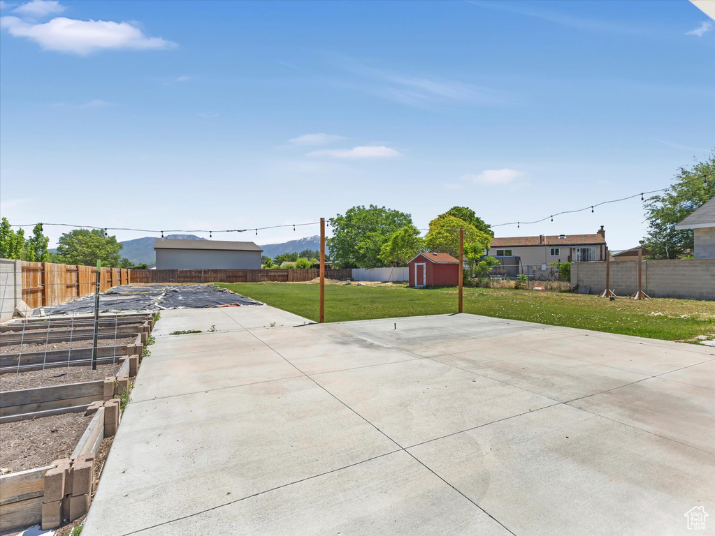 View of yard featuring a patio area and a garden
