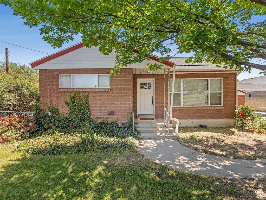 View of front of home featuring brick siding