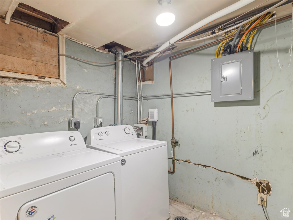 Washroom with electric panel and washer and dryer