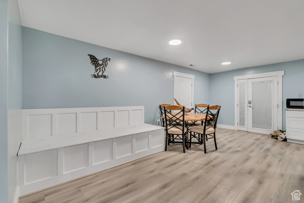 Dining area featuring light wood-style flooring, recessed lighting, and baseboards