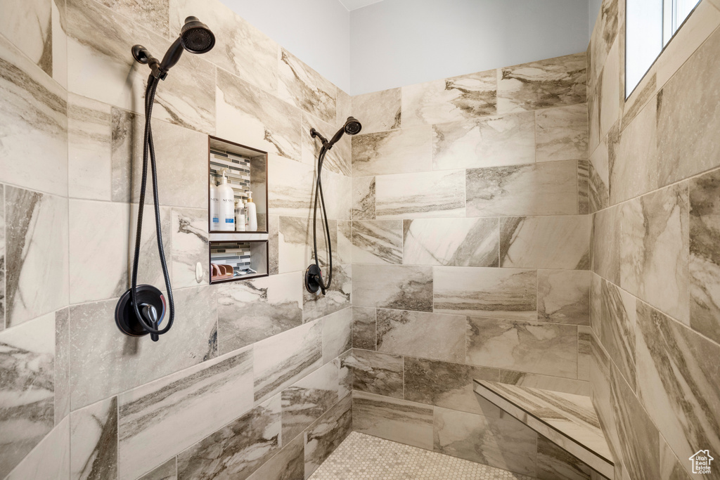 Bathroom featuring tiled shower