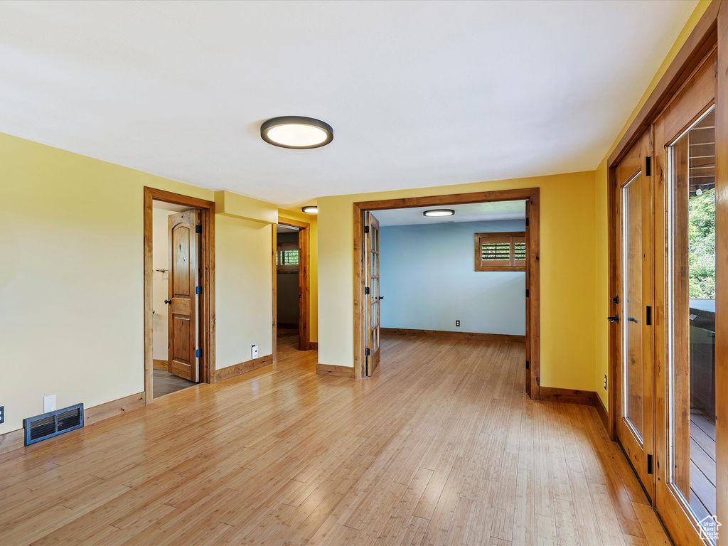 Spare room with light wood finished floors and baseboards
