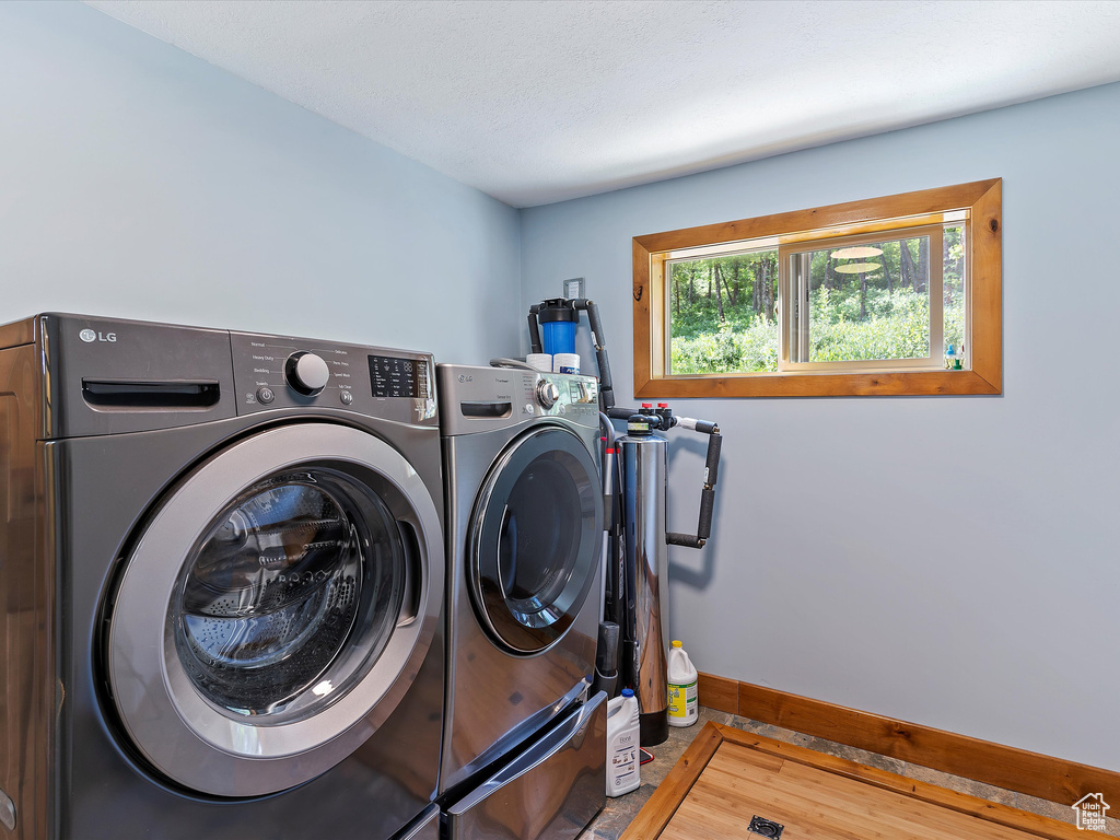 Washroom featuring washing machine and clothes dryer