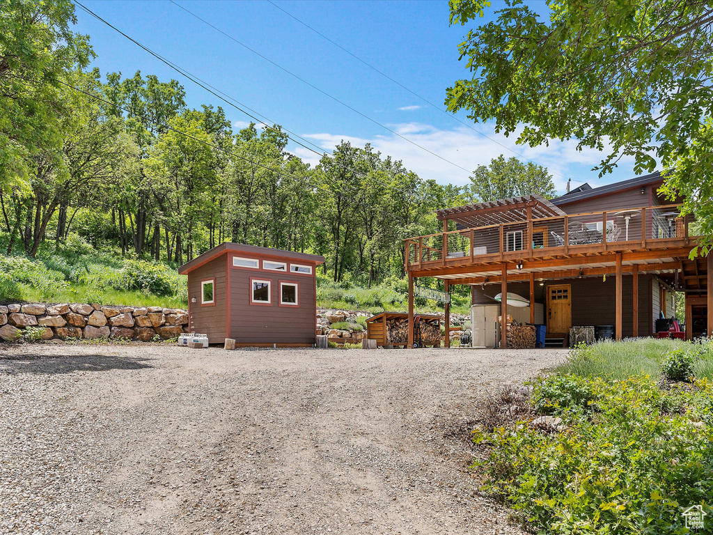Garage with gravel driveway