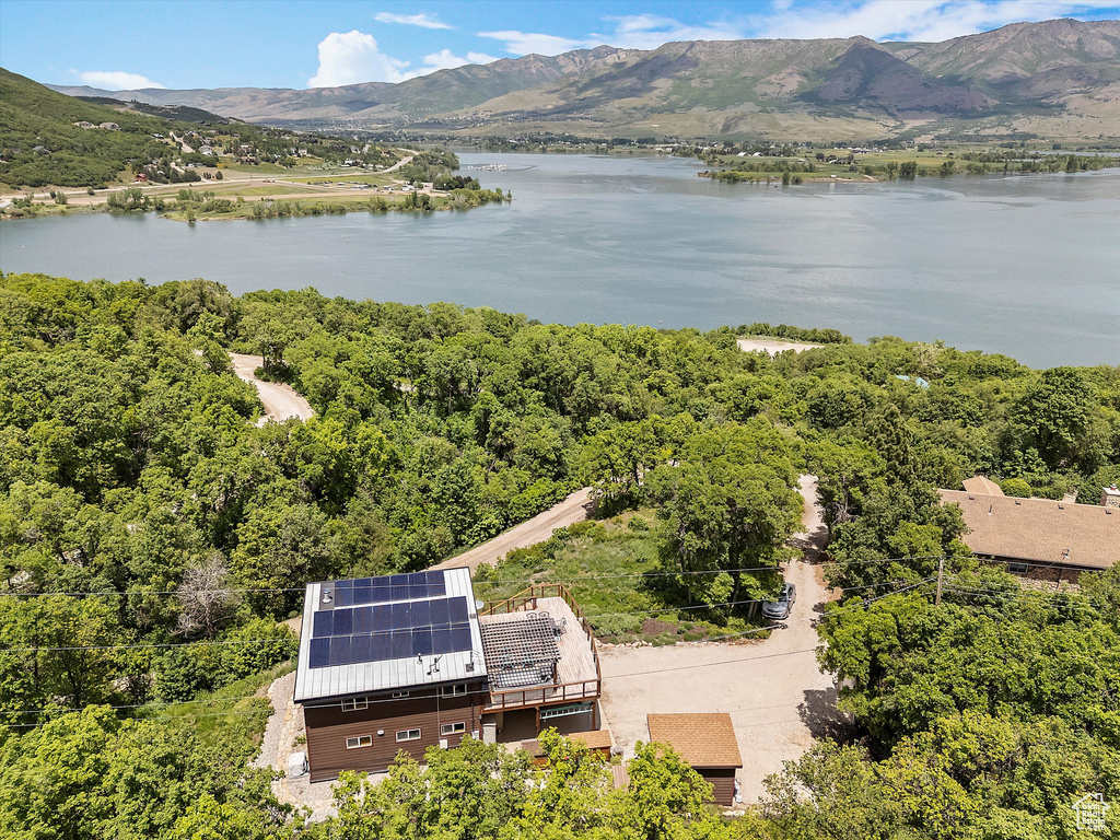 View from above of property with a water and mountain view