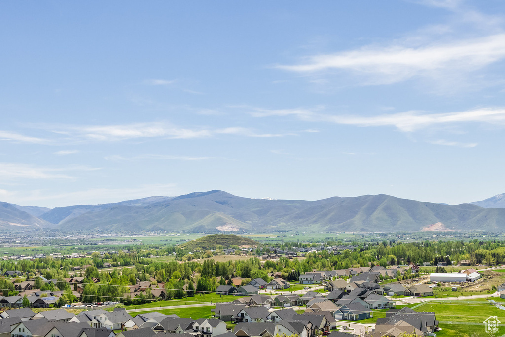 View of mountain backdrop featuring nearby suburban area